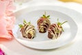 Chocolate covered strawberry on plate Royalty Free Stock Photo