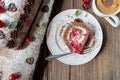 Chocolate cream cake with cherries on wooden background Royalty Free Stock Photo