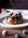 Chocolate cream mousse cake with fresh berries. delicious dessert. Royalty Free Stock Photo