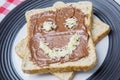 Chocolate cream spread on bread with funny face Royalty Free Stock Photo