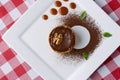 Chocolate creme brulee with cocoa powder, walnuts and mint leaf. Traditional French vanilla cream dessert. Royalty Free Stock Photo