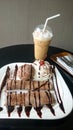 Chocolate crepe served with ice cream and whipping cream Royalty Free Stock Photo