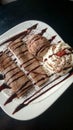 Chocolate crepe served with ice cream and whipping cream Royalty Free Stock Photo
