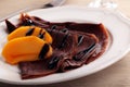 Chocolate crepes with persimmon Royalty Free Stock Photo