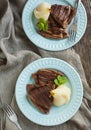 Chocolate crepes with poached pear in syrup Royalty Free Stock Photo