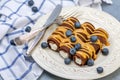 Chocolate crepes with sweet curd filling and caramel sauce