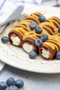 Chocolate crepes with sweet curd filling and caramel sauce
