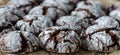 Chocolate crinkle cookies with powdered sugar icing. Cracked chocolate biscuits. close up Royalty Free Stock Photo