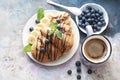 Chocolate croissant, blueberries, banans and black coffee