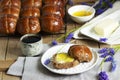 Chocolate cross buns served with butter and honey. Traditional Easter baking.