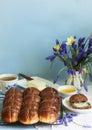 Chocolate cross buns served with butter and honey. Traditional Easter baking.