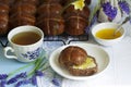 Chocolate cross buns served with butter and honey. Traditional Easter baking.