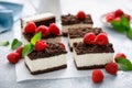 Chocolate cube cake, sliced brownie cheesecake with fresh raspberry