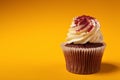 Chocolate cupcake with cream isolated on orange background Royalty Free Stock Photo