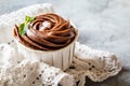 Hocolate cupcake with chocolate cream in white capsules with mint Royalty Free Stock Photo