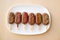 chocolate cupcake ice cream. biscuits on a stick in the form of ice cream set on a beige background. Royalty Free Stock Photo