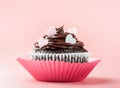 Nice chocolate cupcake with hearts, pink background Royalty Free Stock Photo