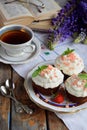 Chocolate cupcake with vanilla cream and strawberries. Vintage style Royalty Free Stock Photo