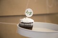 Chocolate cupcake with white frosting on a cake stand Royalty Free Stock Photo