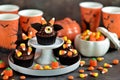 Chocolate cupcakes `bats` - delicious bakery sweets for the celebration of Halloween. Royalty Free Stock Photo