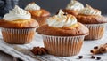 Delicious cupcakes with beige ganache frosting. Dessert with whipped cream. Sweet and tasty food Royalty Free Stock Photo