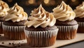 Chocolate cupcakes with beige ganache frosting. Dessert with whipped cream