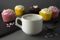 Chocolate cupcakes and coffee , breakfast with colorful cupcakes. Gray background. Sweet dessert Royalty Free Stock Photo