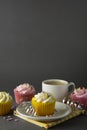 Chocolate cupcakes and coffee , breakfast with colorful cupcakes. Gray background. Sweet dessert. Copy space Royalty Free Stock Photo