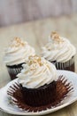 Chocolate Cupcakes With One Peeled Open