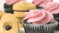 Chocolate cupcakes with raspberry buttercream frosting, and heart shaped cookies Royalty Free Stock Photo
