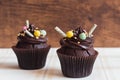 Chocolate cupcakes on rustic wooden background