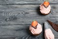 Chocolate cupcakes with strawberry cream. Decorated with half strawberries in chocolate Royalty Free Stock Photo