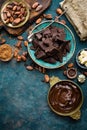 Chocolate. Dark bitter chocolate chunks, cacao butter, cocoa powder and cocoa beans. Chocolate background Royalty Free Stock Photo