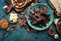 Chocolate. Dark bitter chocolate chunks, cacao butter, cocoa powder and cocoa beans. Chocolate background Royalty Free Stock Photo