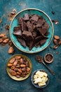 Chocolate. Dark bitter chocolate chunks, cacao butter, cocoa powder and cocoa beans. Chocolate background Royalty Free Stock Photo