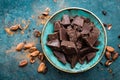 Chocolate. Dark bitter chocolate chunks, cacao butter, cocoa powder and cocoa beans. Chocolate background Royalty Free Stock Photo
