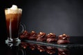 Chocolate dessert with hazelnut and coffee with cream on a black background Royalty Free Stock Photo