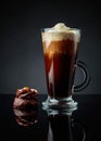 Chocolate dessert with hazelnut and coffee with cream on a black background Royalty Free Stock Photo