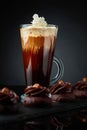 Chocolate dessert with hazelnut and coffee with cream on a black background Royalty Free Stock Photo