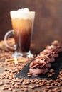 Chocolate dessert with hazelnut and Irish coffee with cream on a wooden table Royalty Free Stock Photo