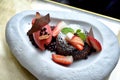 Chocolate dessert with red berries ice-cream, Chocolate lava cake with sweet summer fresh fruit Royalty Free Stock Photo