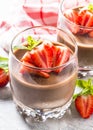 Chocolate dessert of whipped cream and strawberries in glass. Royalty Free Stock Photo