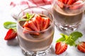 Chocolate dessert of whipped cream and strawberries in glass. Royalty Free Stock Photo