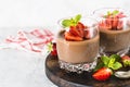 Chocolate dessert of whipped cream and strawberries in glass. Royalty Free Stock Photo