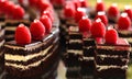 Chocolate devil cake slices displayed in a buffet