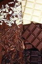 Chocolate in diffrent color. milk, dark and white chocolate bars on table Royalty Free Stock Photo