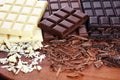 Chocolate in diffrent color. milk, dark and white chocolate bars on table Royalty Free Stock Photo