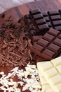 Chocolate in diffrent color. milk, dark and white chocolate bars on table Royalty Free Stock Photo