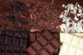 Chocolate in diffrent color. milk, dark and white chocolate bars on table Royalty Free Stock Photo