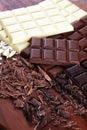 Chocolate in diffrent color. milk, dark and white chocolate bars on table Royalty Free Stock Photo